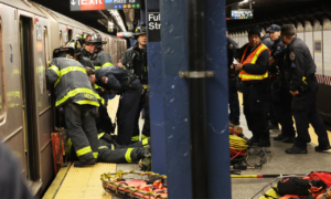 Woman loses both feet after boyfriend pushes her onto subway tracks: Police sources