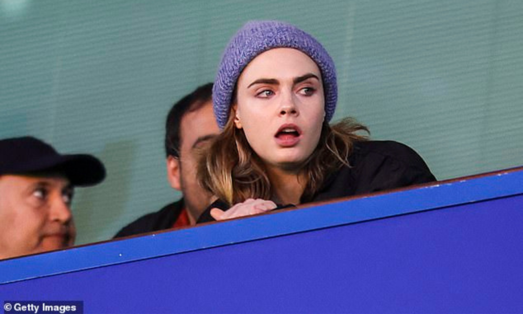 Keeping warm, Cara wore a blue beanie atop her head